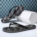 Youthful Black Flip-Flops with Cartoon Skull Print - Fun and Edgy Footwear for Concerts and Festive Casual Outings
