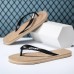 Youthful Black Flip-Flops with Cartoon Skull Print - Fun and Edgy Footwear for Concerts and Festive Casual Outings